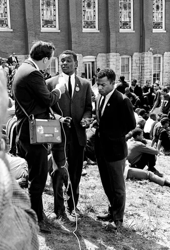 Paul Good, left, ABC News' Southern bureau chief, interviews Lester McKinnie and John Lewis at the sit-in demonstrators base of the First Baptist Church on 8th Ave. N., April 30, 1964. The group is getting ready march downtown to stop briefly at five restaurants on their way to the trials of demonstrators arrested earlier in the week.
Photo credit: J.T. Phillips / The Tennessean